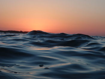 Scenic view of sea against clear sky during sunset