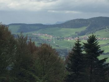 High angle view of trees and mountains against sky