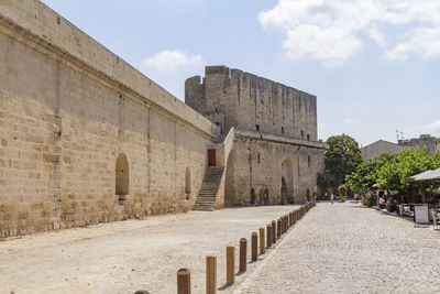 View of historical building against cloudy sky