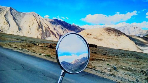 Reflection of mountain range against sky