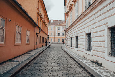 Narrow alley amidst buildings in town