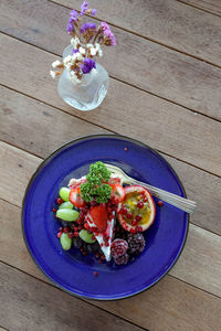 High angle view of flowers in bowl on table