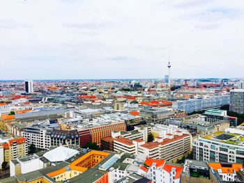 Cityscape with fernsehturm against sky