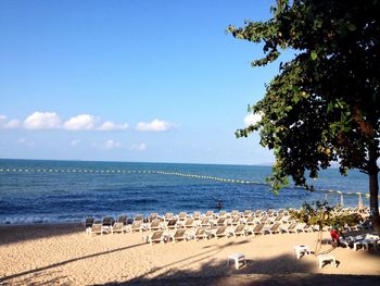 Scenic view of beach against blue sky