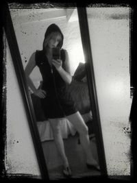 Full length of woman standing on bench