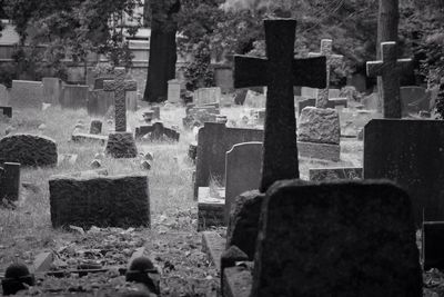 Crosses on tombstones at cemetery