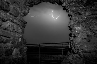 Low angle view of lightning against sky at night