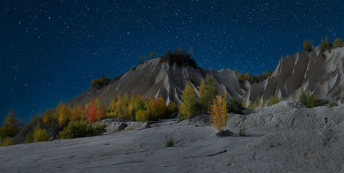 Low angle view of mountain against sky at night