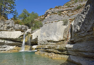 Scenic view of waterfall against clear sky france 