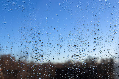 Full frame shot of wet glass window