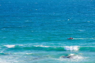 Scenic view of sea against blue sky