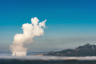 Air pollution over coal power plant mae moh lampang at morning with fog, bird eye view.