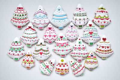 Multi colored various gingerbread cookies on white background
