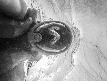 High angle view of bubbles in wet sand