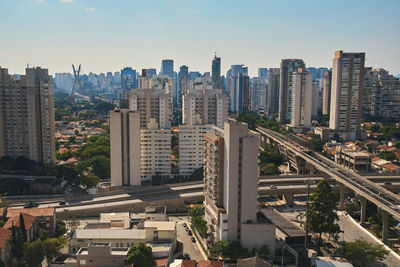 High angle view of buildings in city against sky