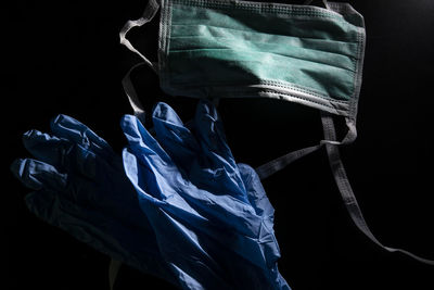 Low angle view of rope against blue background