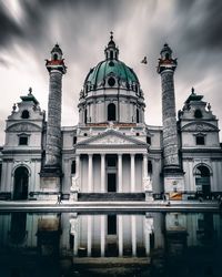 View of sculpture of building against cloudy sky