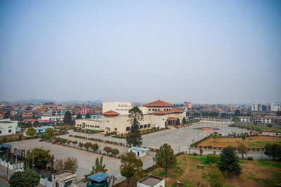High angle view of buildings against clear sky
