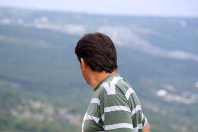 Man against mountains and sky