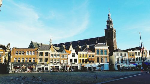 View of buildings in town against sky