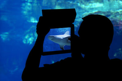 Man photographing with digital tablet