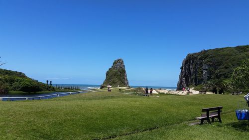 Panoramic view of sea against clear blue sky