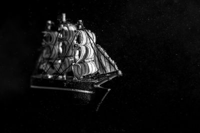 Close-up of electric lamp against black background