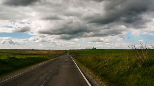 Road passing through rural landscape