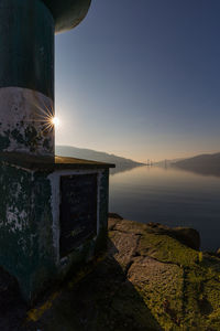Scenic view of sea against clear sky during sunset