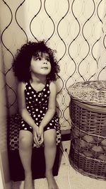 Young woman sitting in basket