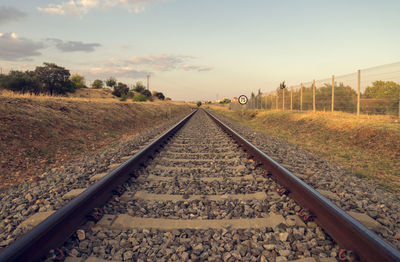 Surface level of railroad tracks against sky