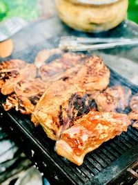 High angle view of meat on barbecue grill