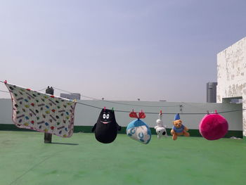 Clothes drying on clothesline against sky