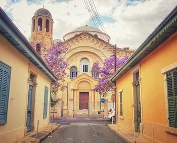 Street amidst buildings against sky