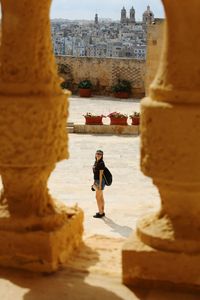 Full length of woman walking in historic building