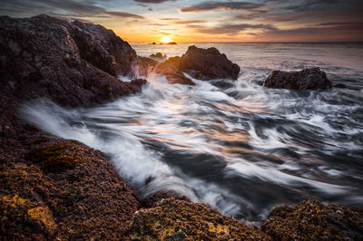 Scenic view of sea against sky during sunset