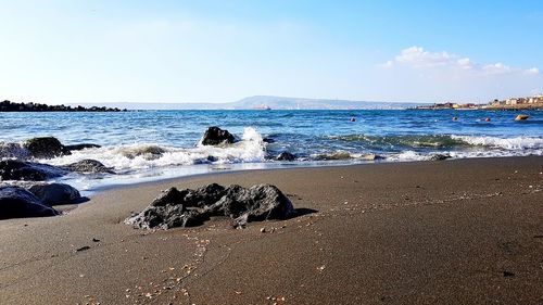 View of calm beach against the sky