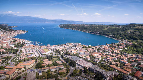 High angle view of townscape and sea against sky