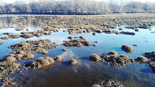 Reflection of rocks in lake water