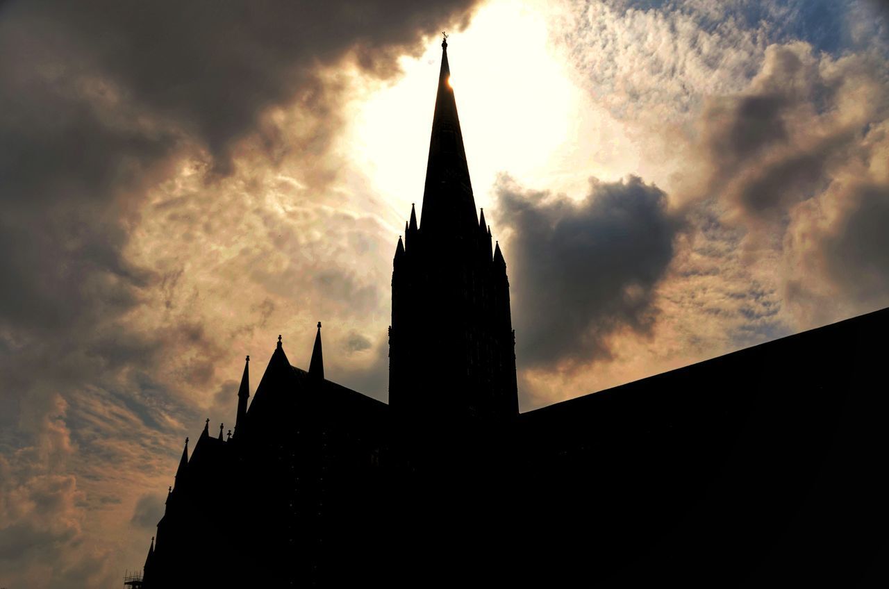 LOW ANGLE VIEW OF SILHOUETTE BUILDING AGAINST SKY AT SUNSET