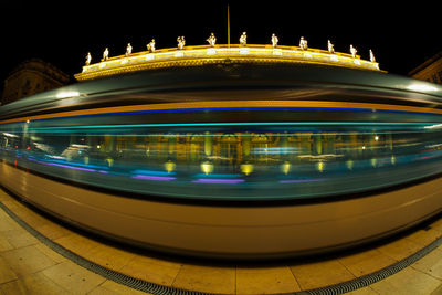 Light trails on illuminated city at night