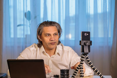 Man blogging while sitting at office