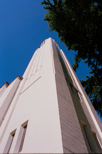 Low angle view of building against clear blue sky