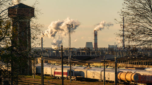 Smoke emitting from train against sky