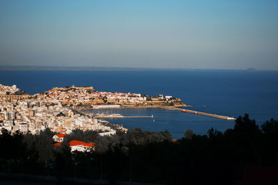High angle view of towns cape of kavala by sea against sky