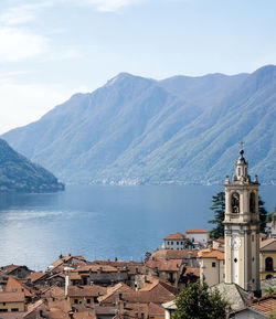 Scenic view of sea and mountains against sky