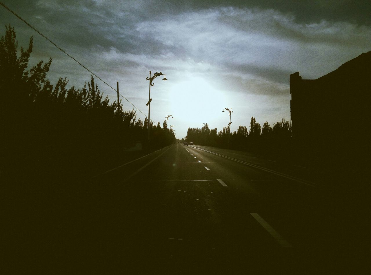 the way forward, sky, transportation, diminishing perspective, vanishing point, road, cloud - sky, cloudy, cloud, silhouette, street, road marking, nature, sunset, outdoors, empty road, no people, sunlight, landscape, built structure