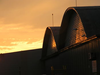 Low angle view of building against sky during sunset