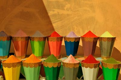 Colorful powder paint in containers arranged at market