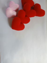 High angle view of multi colored candies on white background